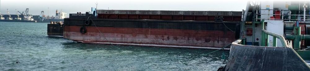 Barge section moored in a sea port
